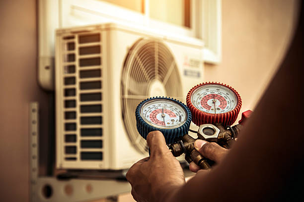 Professional Heat Pump Repair technician working in Scottdale, GA